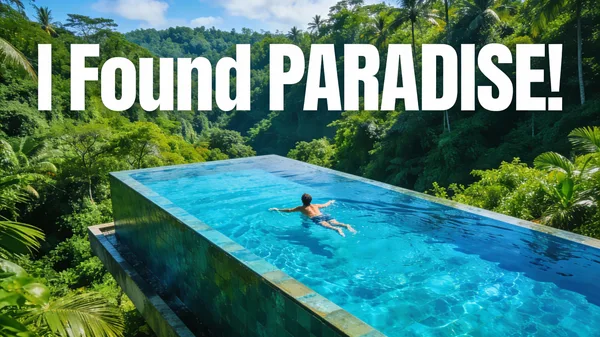 A person swimming in a luxury infinity pool overlooking a lush green Bali jungle.