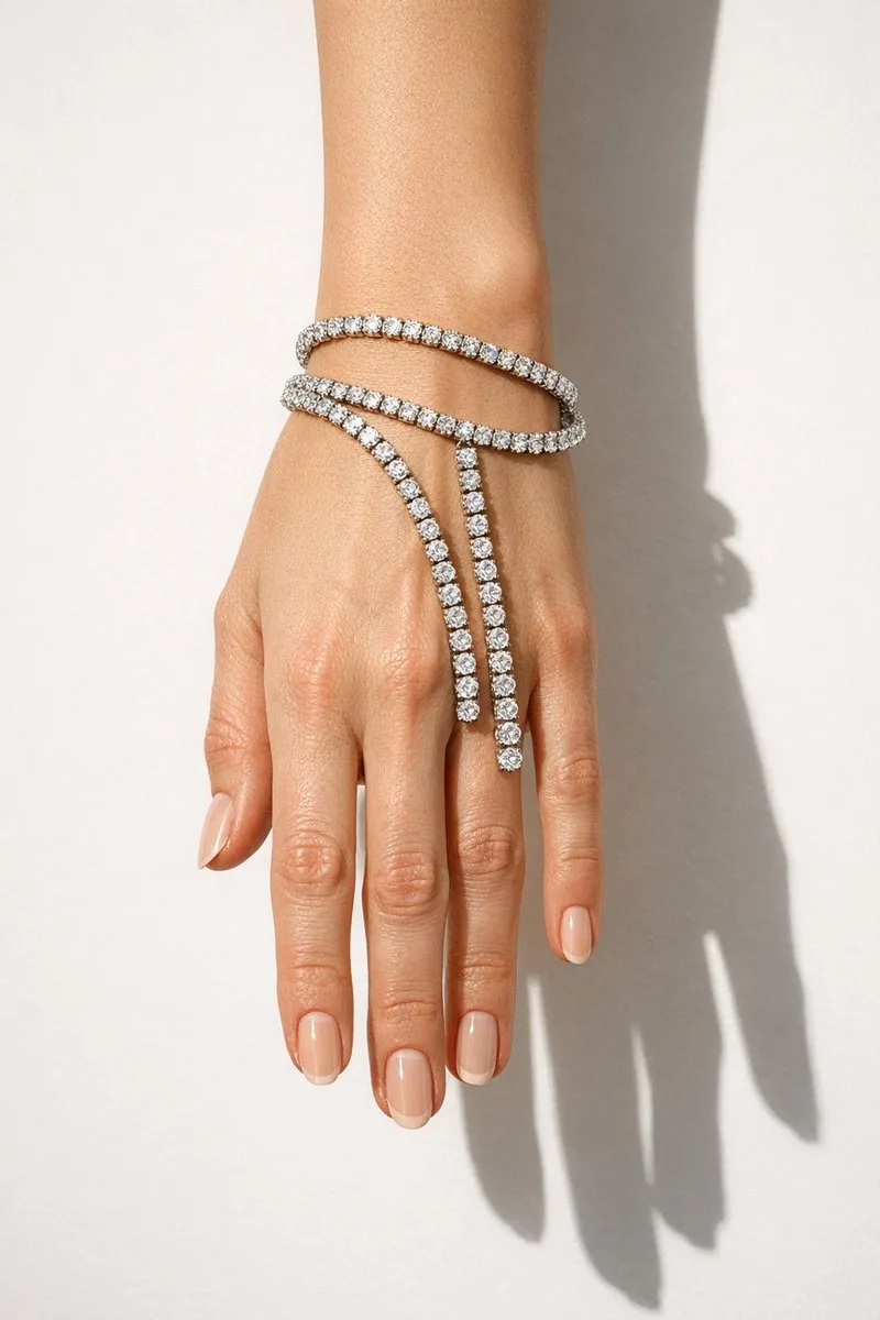 Elegant diamond bracelets on a hand against a white background. (2)