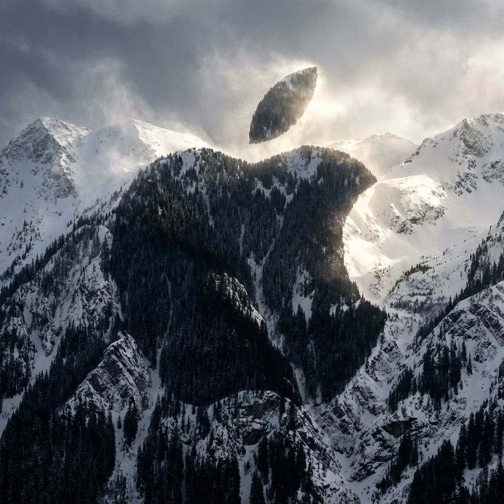 Aerial view of a misty mountain range forming a hidden logo shape. (2)