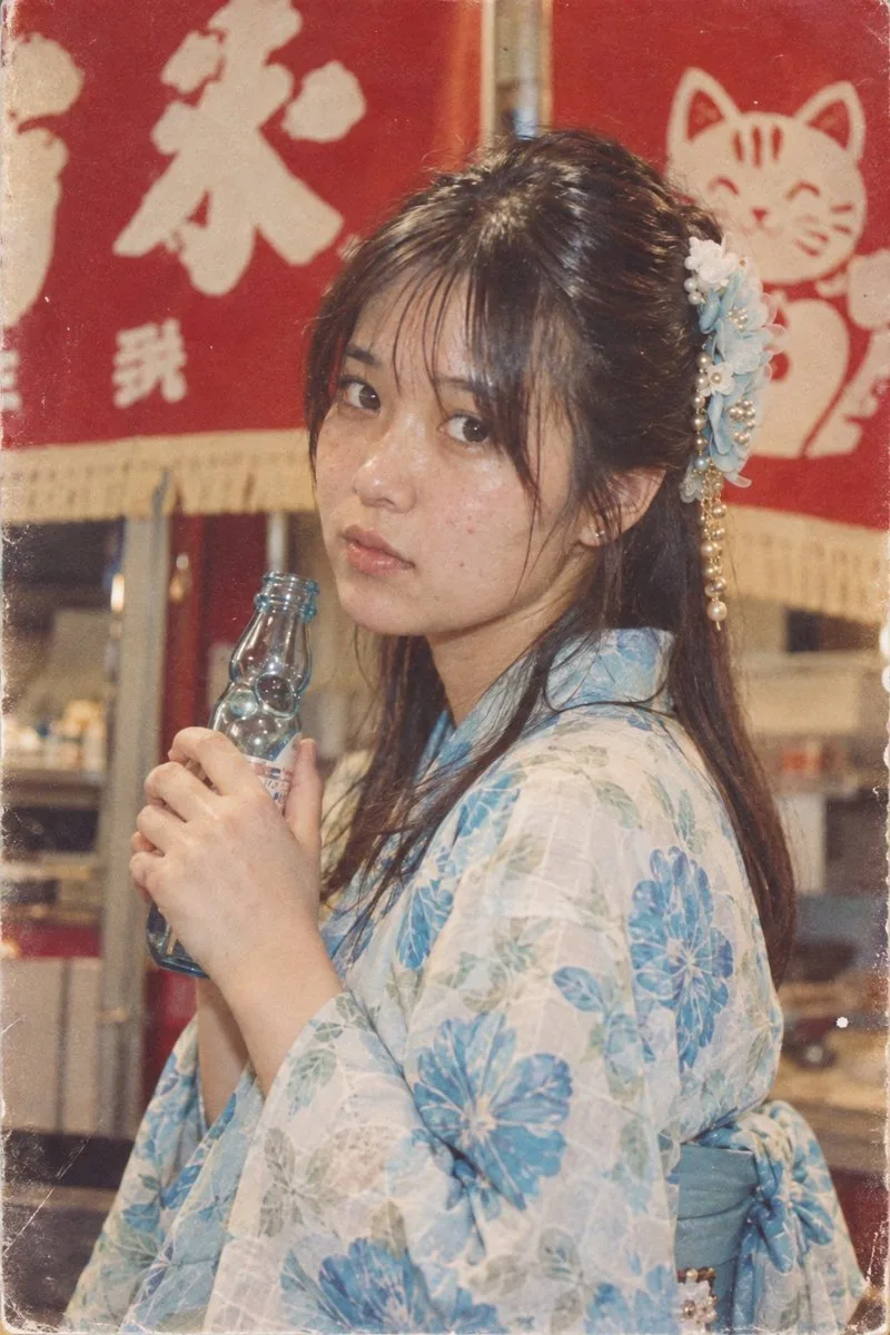 Retro Japanese woman in a yukata holding a Ramune bottle